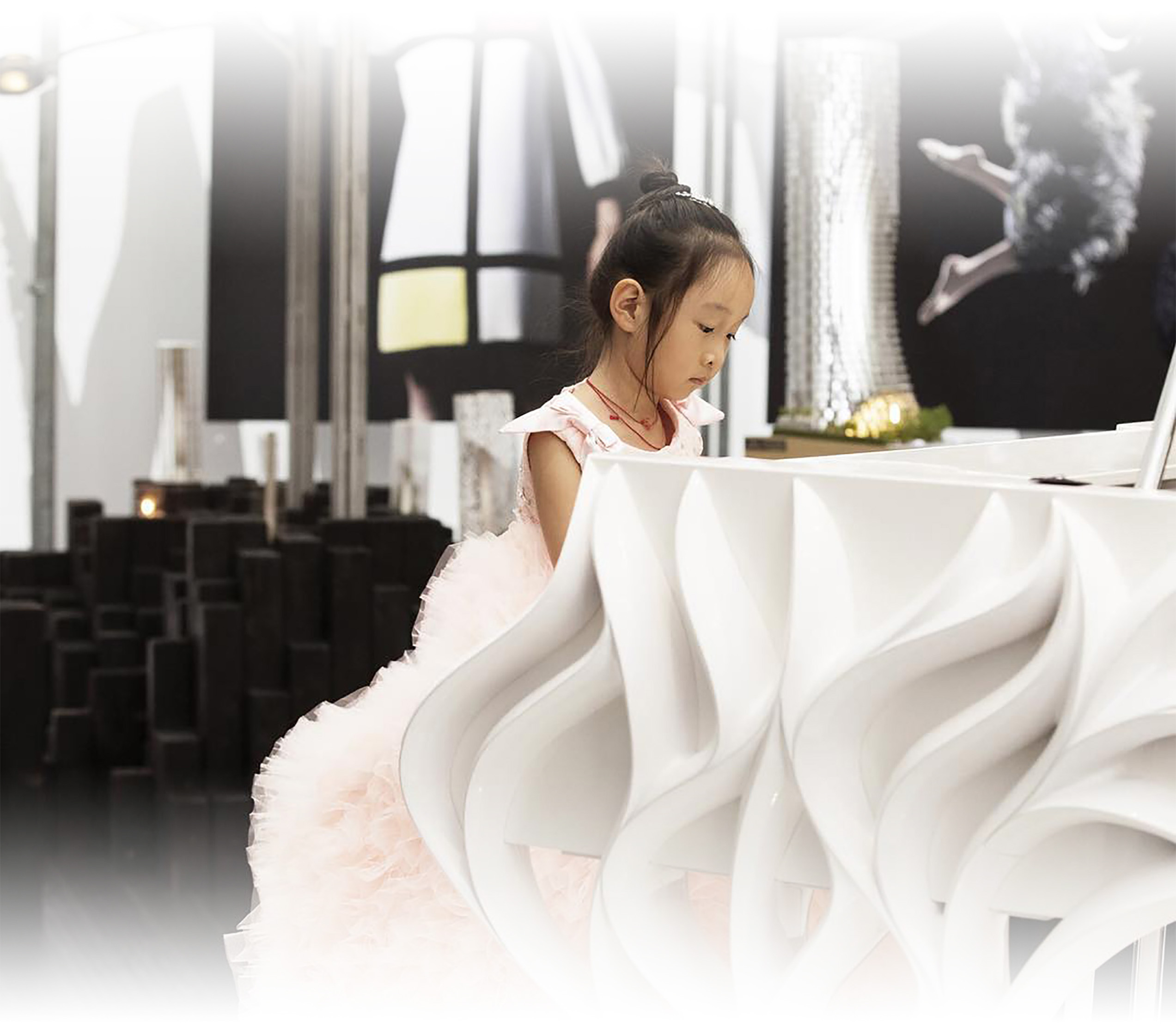 Young girl playing Fazioli