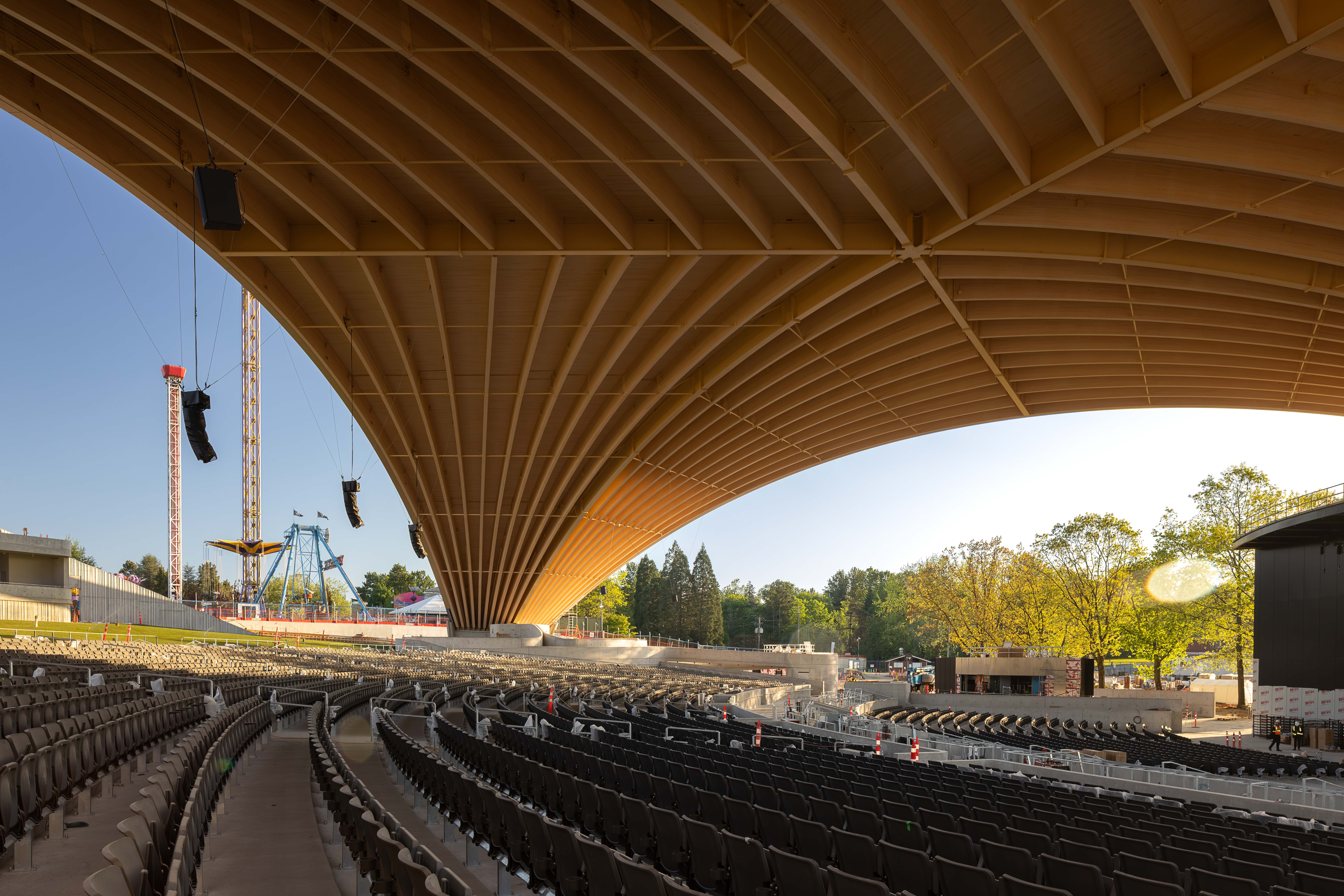 PNE Amphitheatre by Revery Architecture, Vancouver, BC - interior open air view of long-span mass timber roof